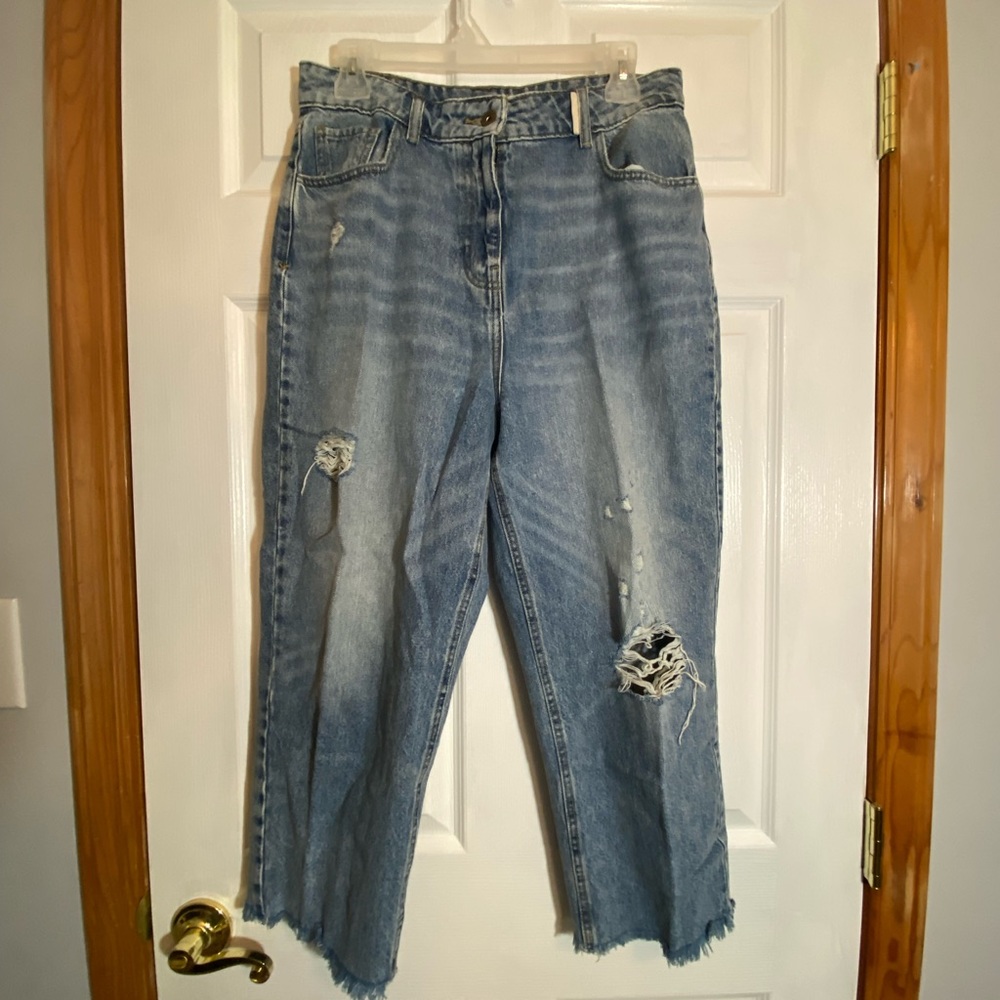 Cropped woman’s blue jeans